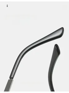 Detail of curved black glossy sunglasses temple with silver metal hinge for comfort