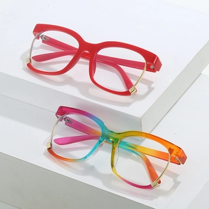 Oversized glasses frames in red and rainbow gradient with gold metal trim