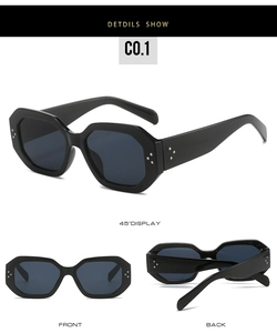 Macro details of black octagonal sunglasses featuring silver rivet accents and dark lenses