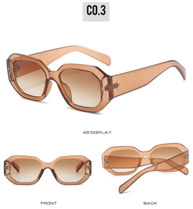 Detailed view of translucent amber hexagonal sunglasses with star metal studs