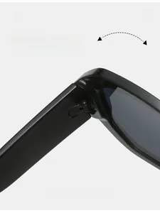 Close-up of the durable metal hinge and sleek black frame of polygon sunglasses