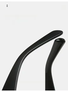 Close-up of curved glossy black temple tips on stylish rivet square sunglasses