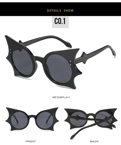 Detailed views of black bat-shaped sunglasses with silver accents and dark round lenses