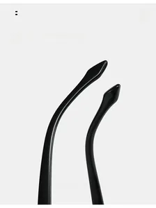 Detail view of glossy black curved mirror legs on butterfly sunglasses frame