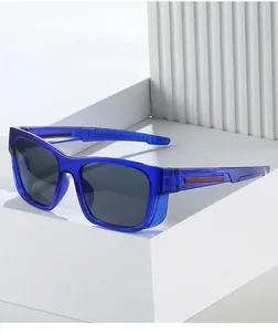 Detail of stylish blue transparent sports sunglasses on minimalist geometric props