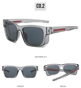 Detail view of sport sunglasses with translucent grey frames and red temple accents