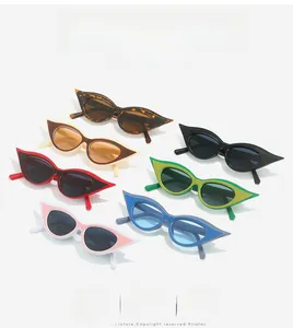 Flat lay of retro cat eye sunglasses showing multiple color variants and polished frames