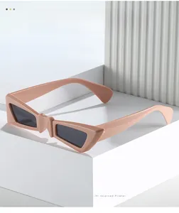 Macro detail of pink geometric butterfly sunglasses with dark grey polarized lenses