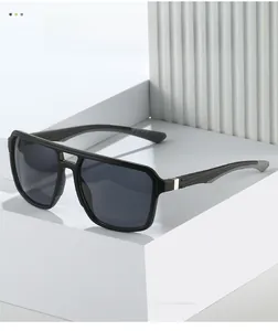 Detail of matte black aviator sunglasses with silver metal accents on a geometric stand