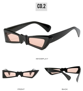 Detail view of butterfly sunglasses in black frame with pink lenses and silver hinges