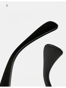 Detail of curved ergonomic temple arms on high-gloss black hip-hop fashion sunglasses
