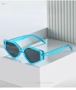 Close-up of trendy blue transparent geometric sunglasses with metallic hinge rivets