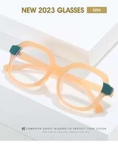 Detailed macro of TR90 frame hinge with orange and green contrast color blocks