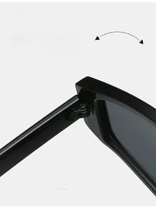 Macro shot of durable metal hinges on sleek black geometric triangle sunglasses