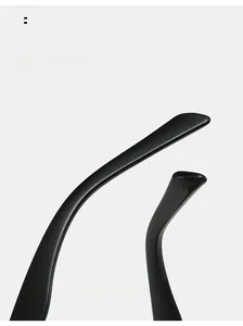 Detail of ergonomic curved temple tips on black triangle sunglasses for comfortable fit