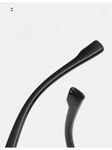 Detailed macro view of curved black TR eyeglass legs with smooth polished finish