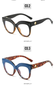 Detail of cat eye glasses frames in black and blue tortoise with gold metal accents