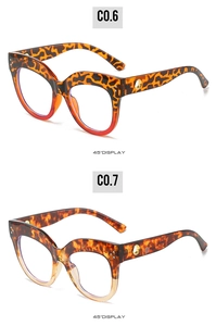 Detailed 45-degree side view of oval cat-eye glasses frames with leopard print texture