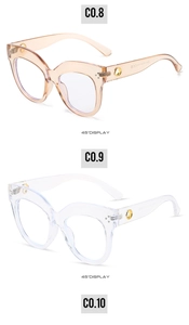 Detail of oval cat eye glasses frames with metal rivets and transparent champagne texture