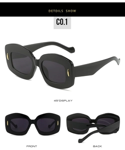 Detailed views of oval sunglasses featuring gold oval rivets and thick black frames