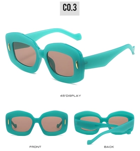 Three-angle view of oval teal sunglasses with gold pin accents and brown lenses