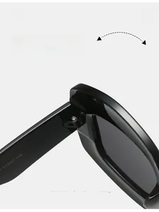 Detail of durable metal hinges and temple size markings on black oval sunglasses