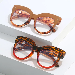 Oval cat eye glasses frames with vintage rivets and bold leopard print patterns