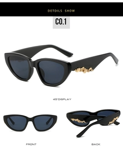 Detail view of black cat-eye sunglasses with gold wavy temple accents in multiple angles