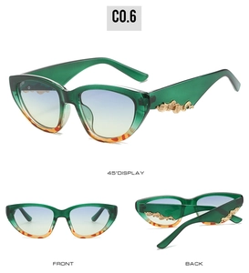 Detailed views of cat eye sunglasses featuring green frames and gold ornate scrollwork