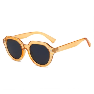 Lunettes de soleil polygonales rétro avec monture ambre translucide et verres foncés