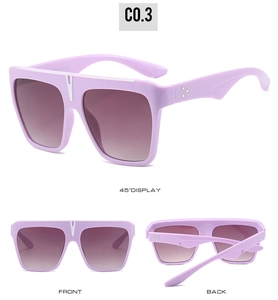 Macro detail of lavender square sunglasses with gradient lenses and decorative metal rivets