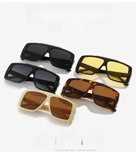 Close-up of oversized square sunglasses with rivet details in multiple frame colors