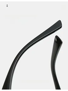 Macro detail of glossy black curved temple tips for comfortable ergonomic sunglasses wear