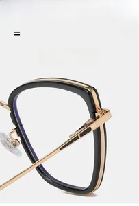 Detail view of lightweight TR90 eyeglass frame with flexible gold metal hinges and silicone pads