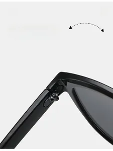 Close-up of durable metal hinge on black sunglasses with thick acetate frame