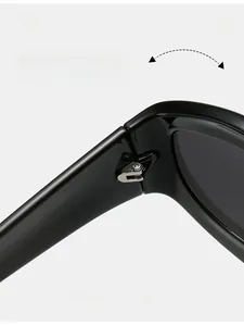 Close-up of durable metal hinge on black cat-eye sunglasses for smooth folding