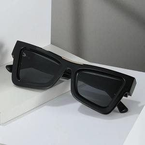 Square fashion sunglasses with thick black frames and decorative gold metal chain detail