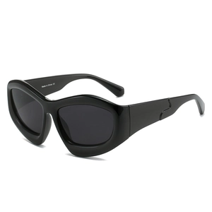 Modern oversized black cat-eye sunglasses with thick glossy frames and dark lenses