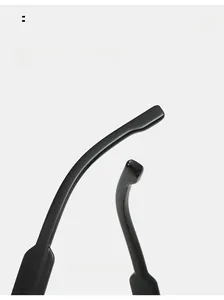 Detail of ergonomic curved mirror legs with glossy black finish on stylish sunglasses