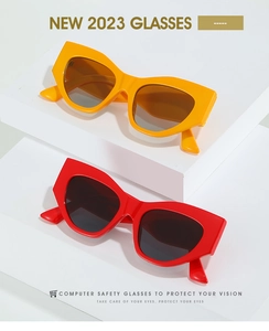 Detail of colorful geometric cat eye sunglasses with wide temples and UV400 lenses