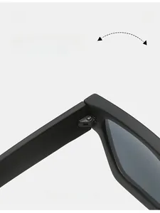 Detail shot of durable metal hinge on black square sunglasses with matte frame