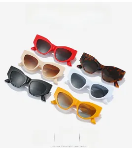 Flat lay of stylish cat eye sunglasses in red beige leopard black white and yellow colors