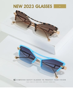 Detail of trendy leopard and blue cat-eye sunglasses with gradient lenses and metal hinges