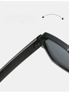 Macro detail of high-quality metal hinge on square black sunglasses with durable texture