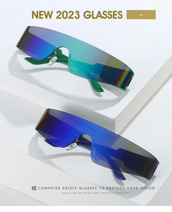 Detail view of colorful oversized wraparound sunglasses with iridescent lenses on white steps