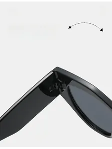Detail of durable texture hinge on black oversized cat eye sunglasses showing flexibility