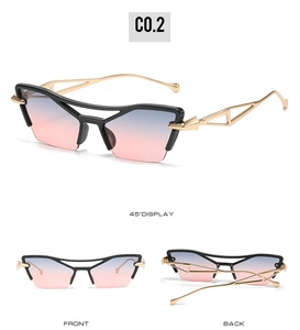 Detail view of cat eye sunglasses with gold hollow metal temples and gradient lenses