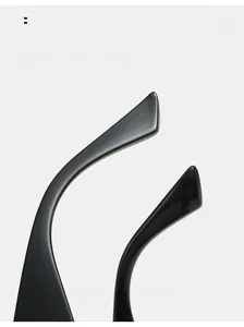 Macro detail of ergonomic curved mirror legs on sleek black cat-eye sunglasses