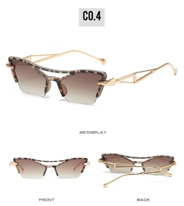 Detail of vintage cat-eye sunglasses with gold metal hollow temples and leopard print frame