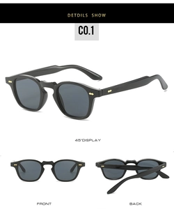 Detail view of punk hip-hop sunglasses with black frames and golden rivet accents